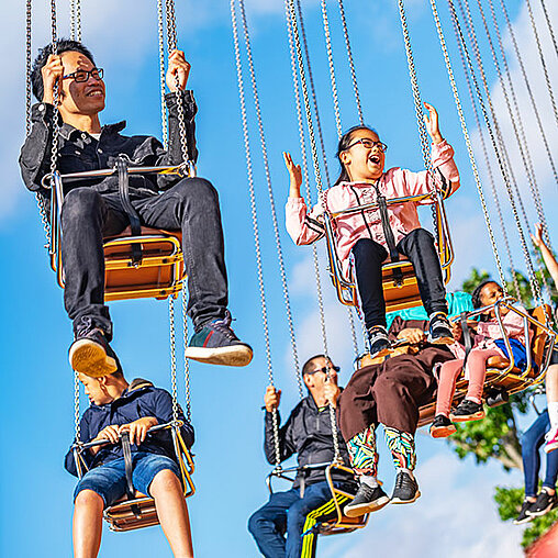 Family on Wave Swinger ride